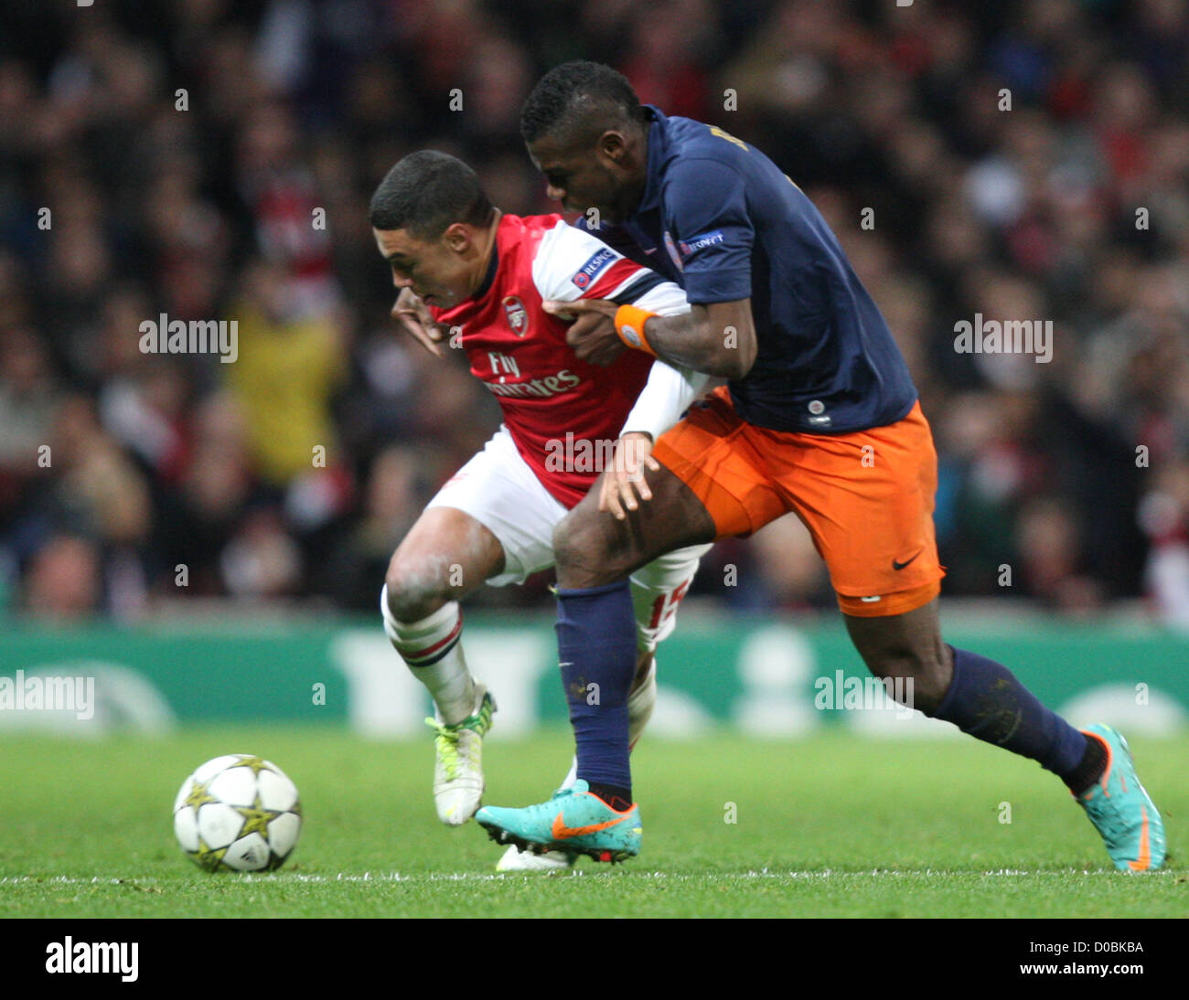 21.11.2012 London, England.  Alex Oxlade-Chamberlain of Arsenal and Henri Bedimo of Montpellier HSC in action during the Champions League Group B game between Arsenal and Montpellier HSC from Emirates Stadium. Stock Photo
