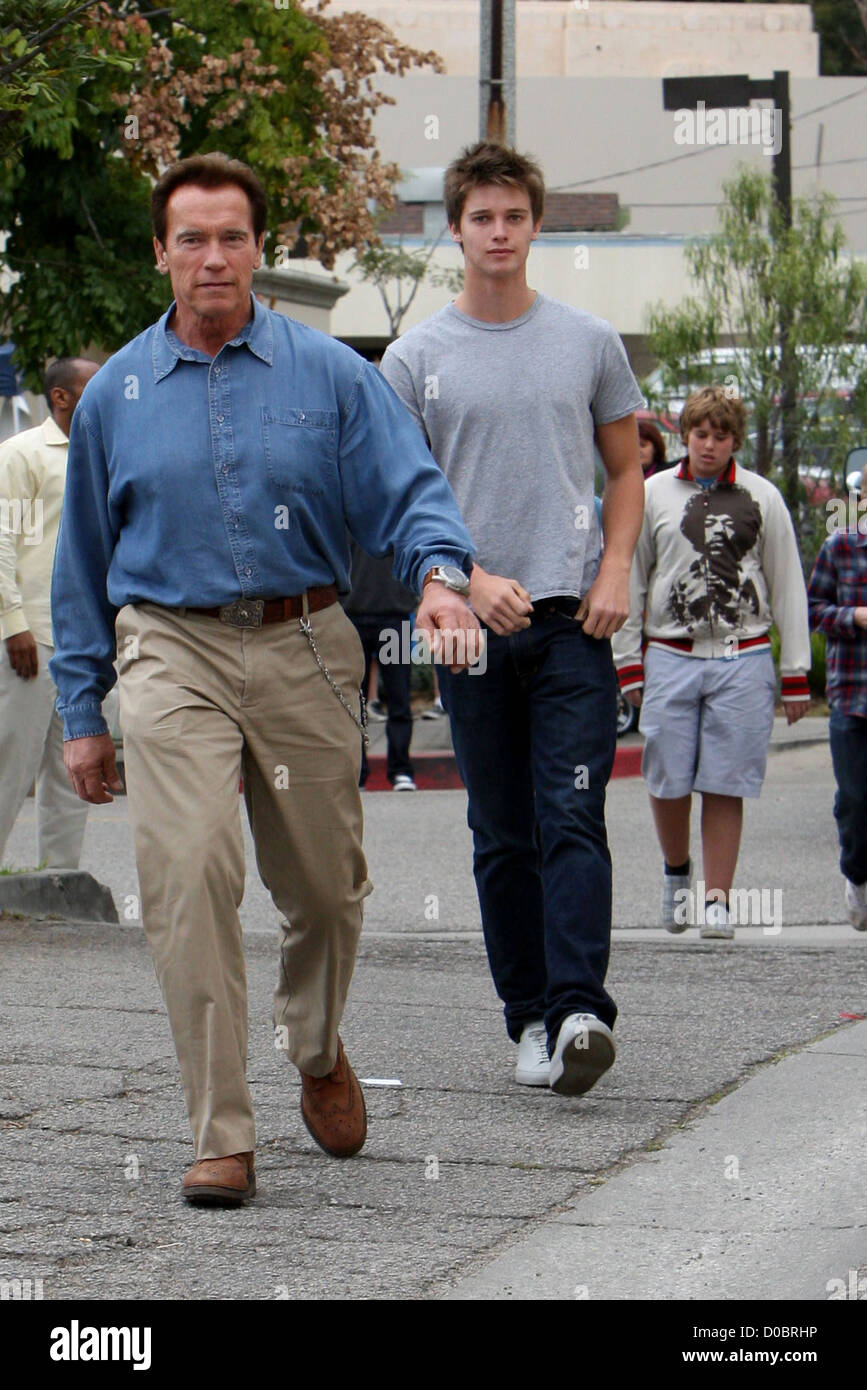 Arnold Schwarzenegger takes his sons to a pop-up animal adoption centre