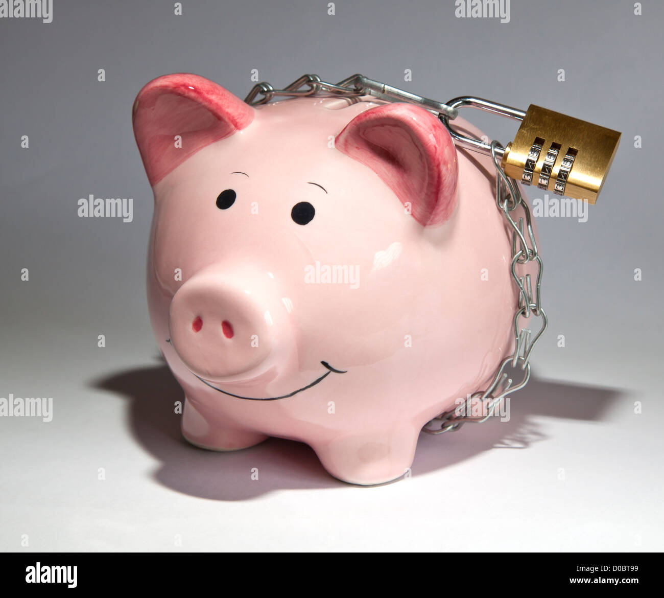 Piggy bank savings locked up Stock Photo
