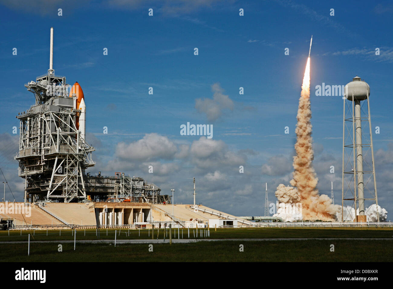 Ares I-X Test with Nearby Space Shuttle Stock Photo