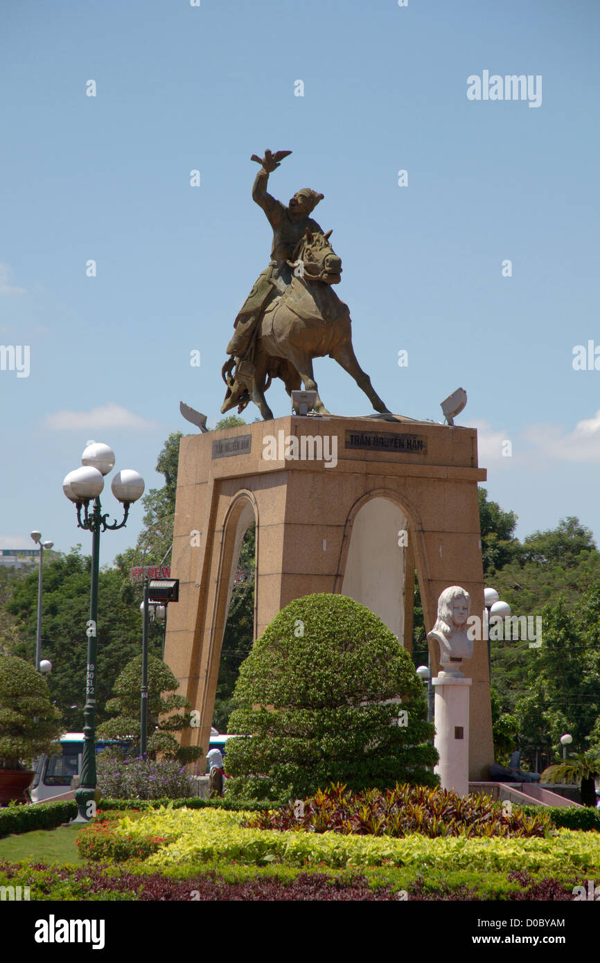 Standing in the middle of a busy traffic roundabout in Saigon is the Tran Nguyen Hai statue. Stock Photo