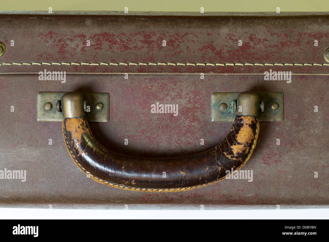 Close up of an vintage suitcase with leather handle Stock Photo