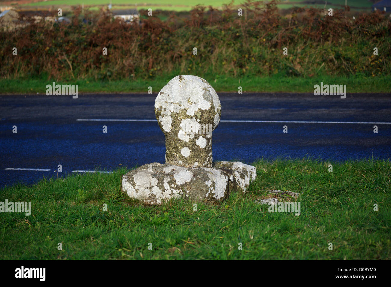Wayside cross, Cornwall. Ancient wayside cross at an intersection of the A30 outside Crows-An-Wra. Stock Photo