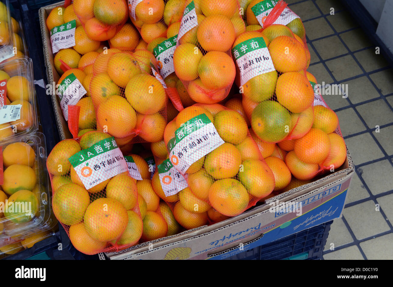 Mandarines in street market, Tokyo, Japan Stock Photo