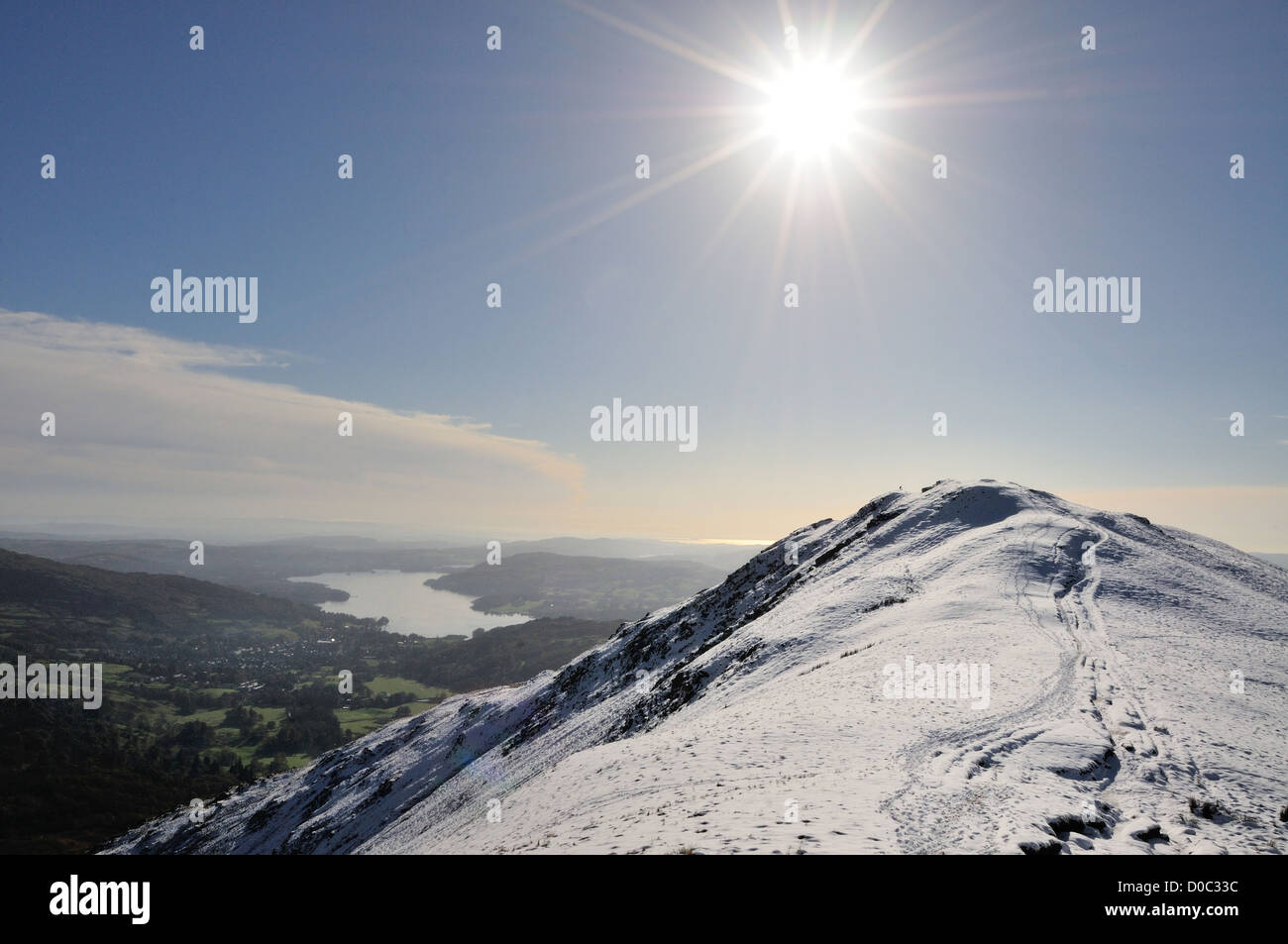 Winter sun above Heron Pike in the English Lake District, with Windermere in the background Stock Photo