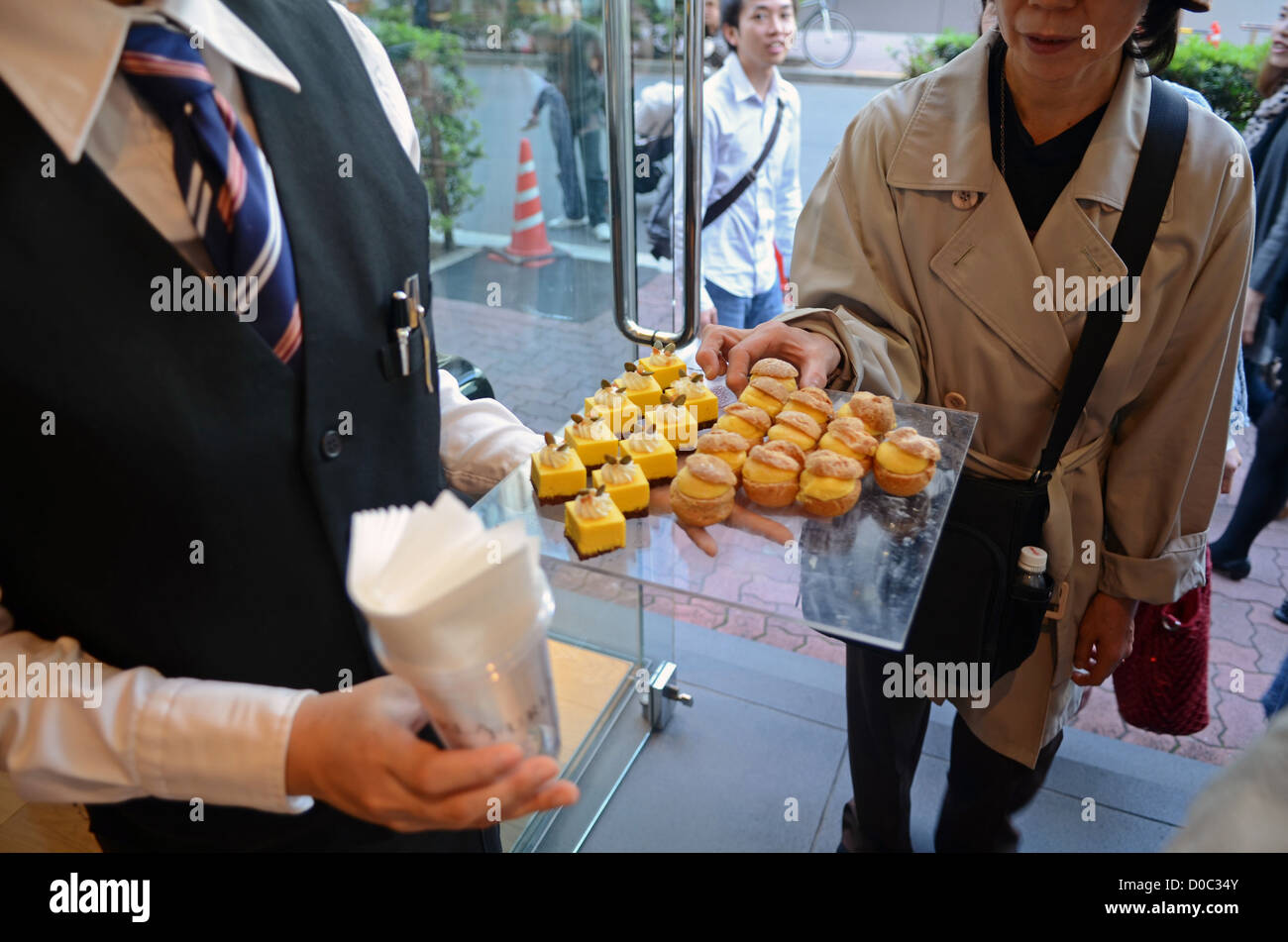 Real model act as mannequins at Furla store, Ginza street, Tokyo Stock