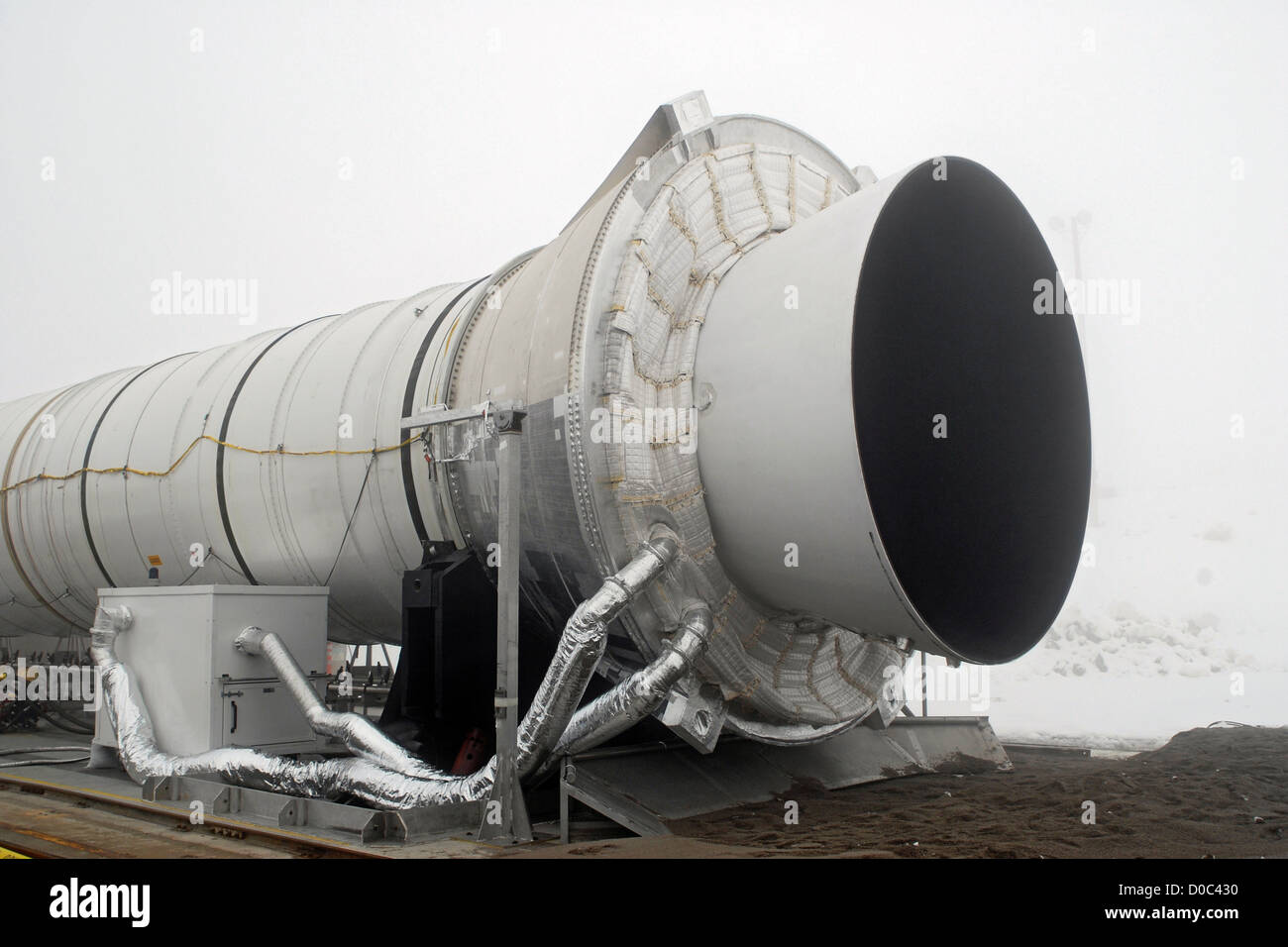 The final space shuttle reusable solid rocket booster be tested is seen on test stand ATK site near Promontory Utah ready be Stock Photo