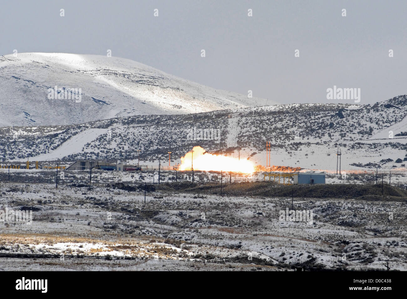 The final space shuttle solid rocket booster test is conducted ATK test site near Promontory Utah on foggy snow-covered morning Stock Photo