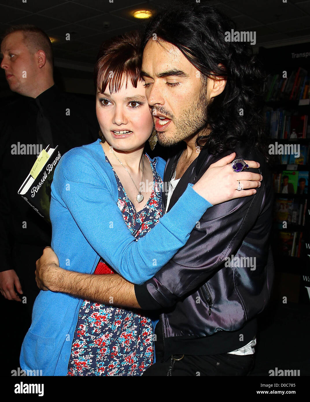 Russell Brand greets 19 year old Beth Tucker and also gives free tickets to his Bristol show whilst at Waterstone's Book Store Stock Photo