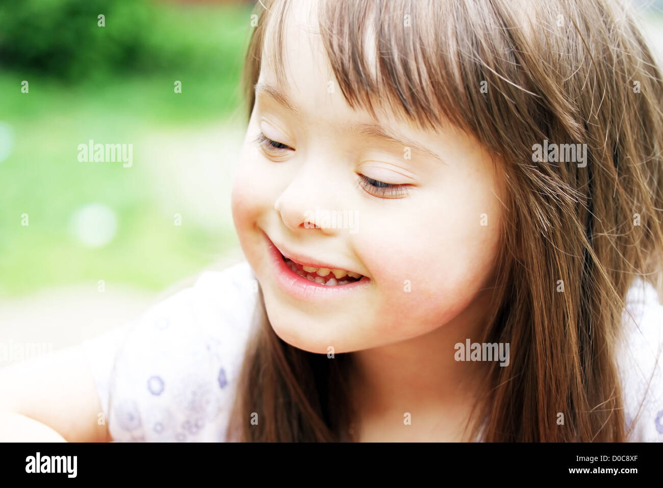 Portrait of beautiful young girl smiling in the park Stock Photo - Alamy