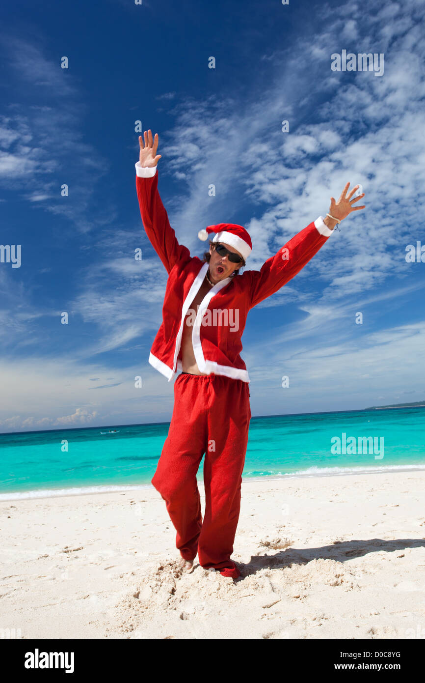 Santa Claus is dancing on beautiful beach Stock Photo
