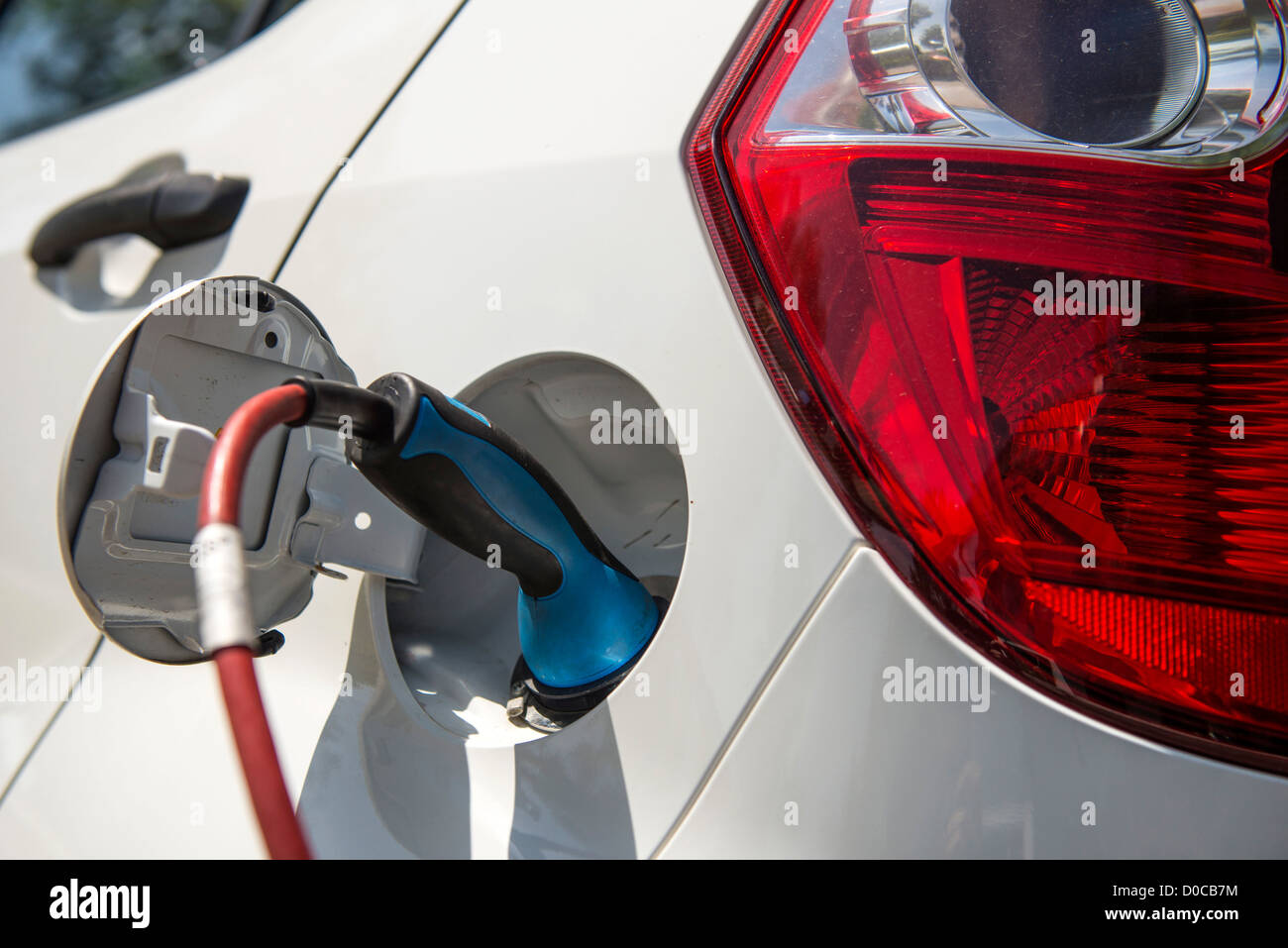 White Electric Car from German E-Cars while charging Stock Photo