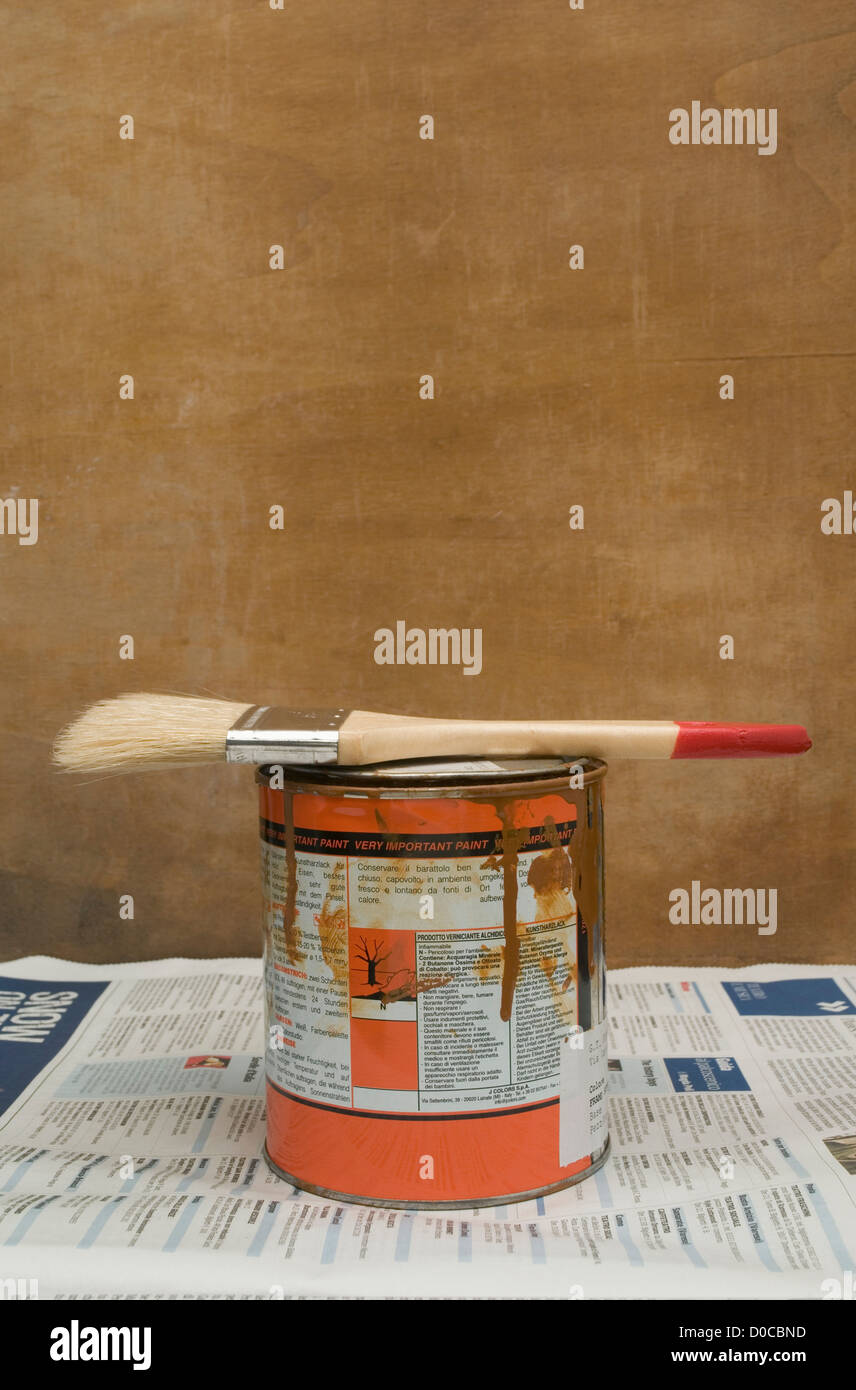 tin of paint and a brush Stock Photo Alamy