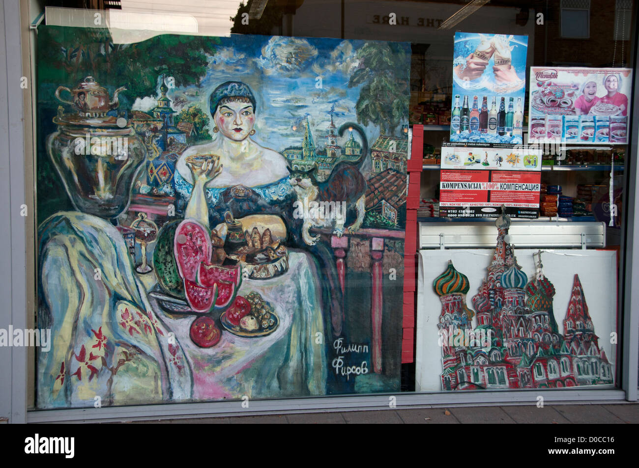 Paintings in the window of a food shop selling eastern European products from Ukraine, Russia, Poland. Stock Photo