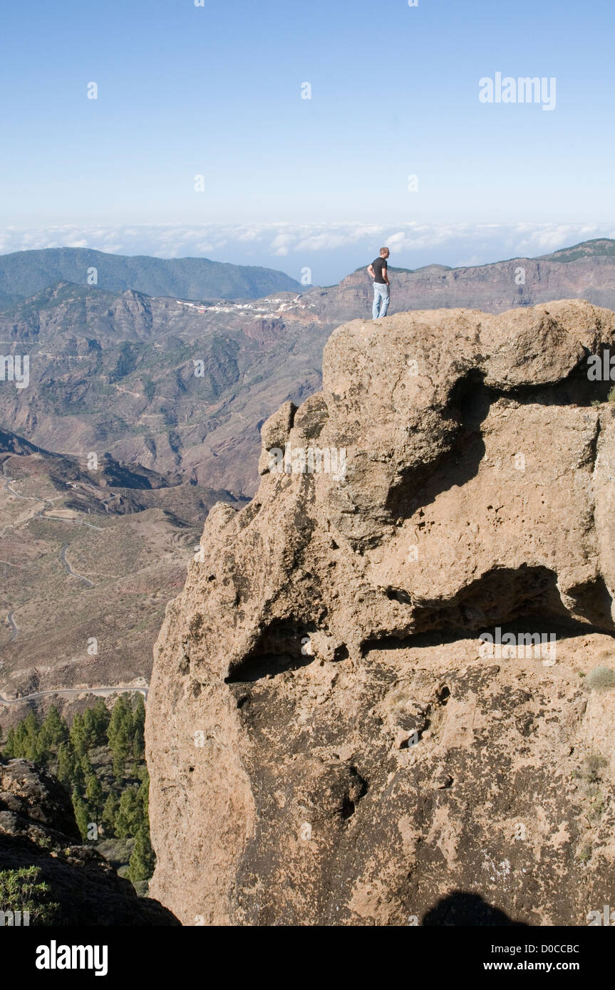 standing on top of the world gran canaria canary islands Roque Nublo man high point life view rocks mountain mountains Stock Photo