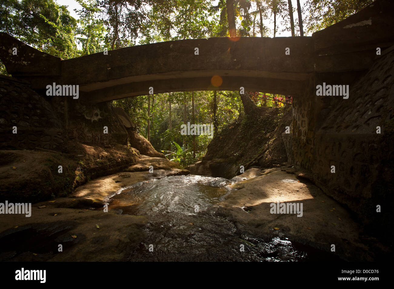Ancient Balinese bridge on top of small river in the forest in Goa Gajah location , Bali , Indonesia Stock Photo