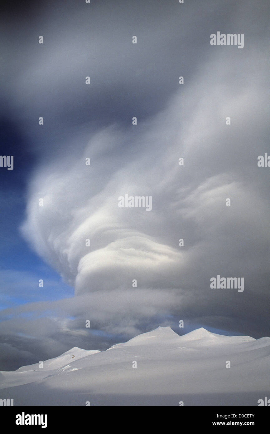 An Orographic Wave Cloud Hovers Above the Summit Complex of Mount Logan Stock Photo