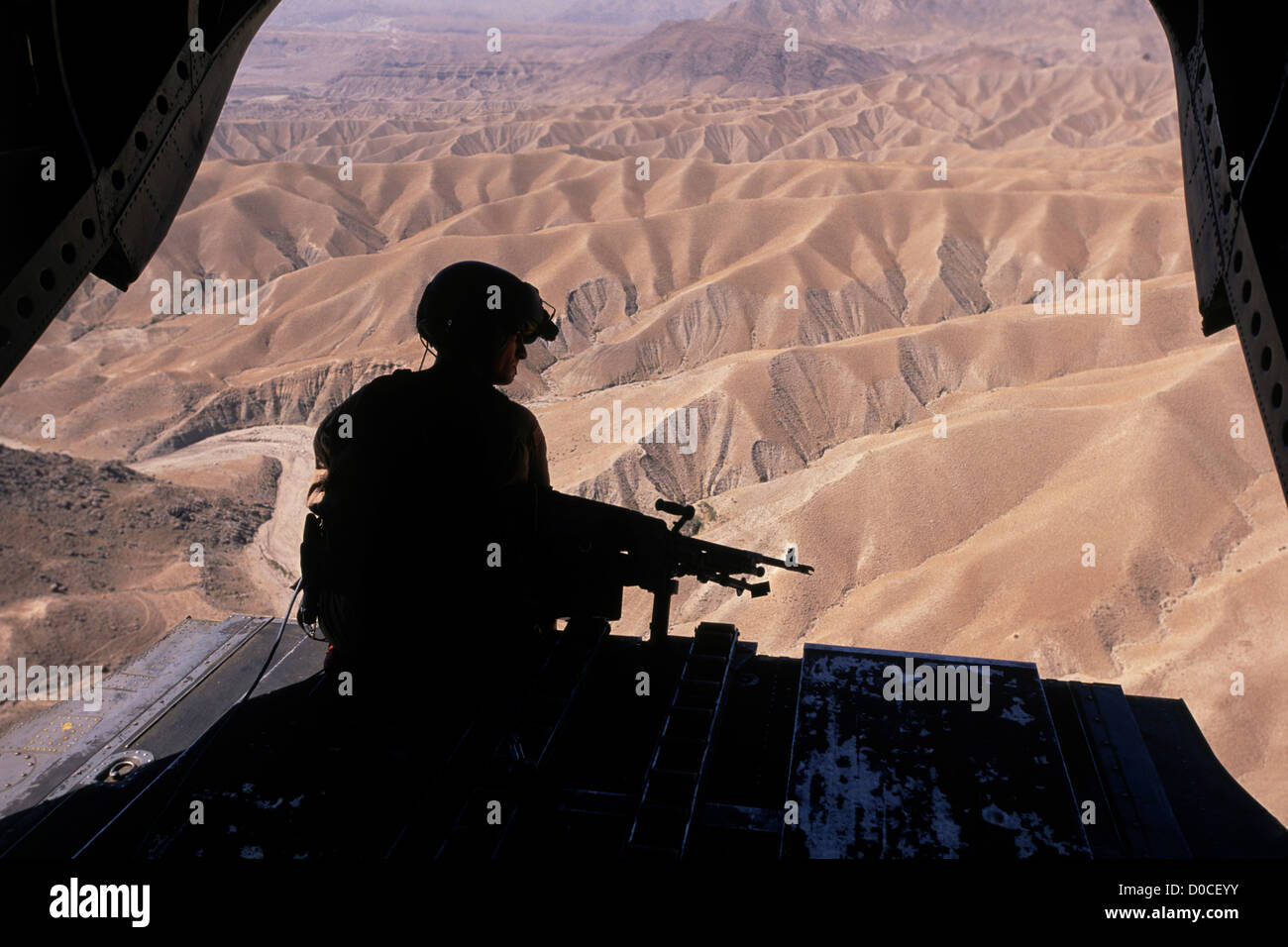 A CH-47 Chinook Ramp Gunner Scans the Afghan Countryside Stock Photo