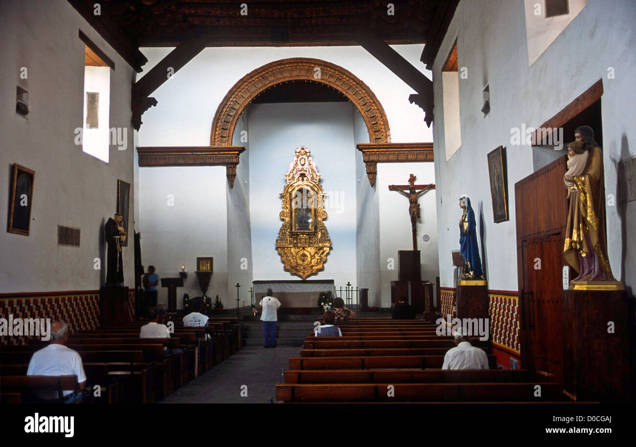 MEXICO DEVOUT CITIZENS,MAINLY MEN, OF CIUDAD JUAREZ PRAY IN THE TOWNS MAIN CHURCH Stock Photo