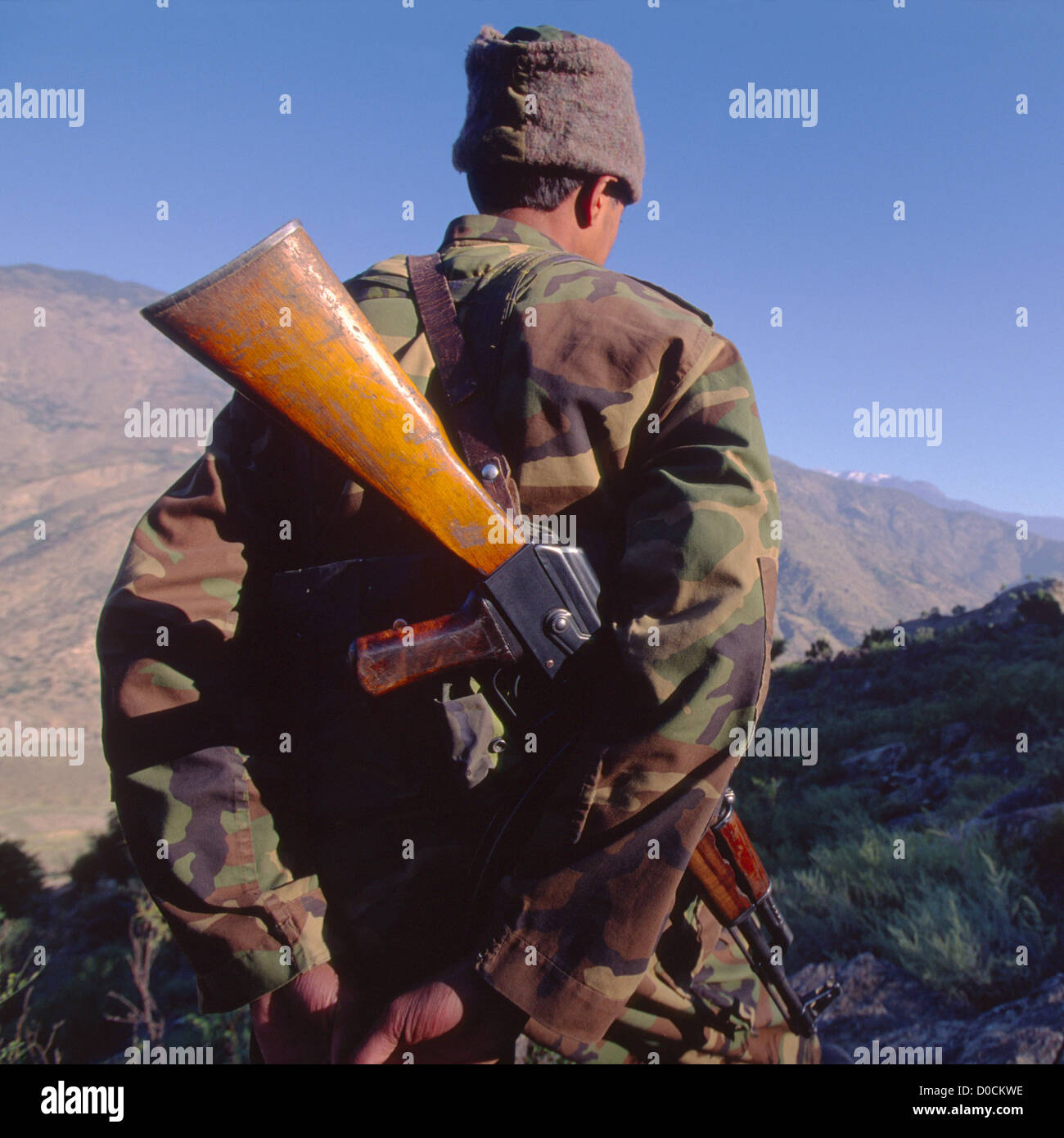 An Afghan National Army Soldier Scans Mountains During Raid on Suspected Al Qaeda Training Camp in Foothills Afghanistan's Stock Photo