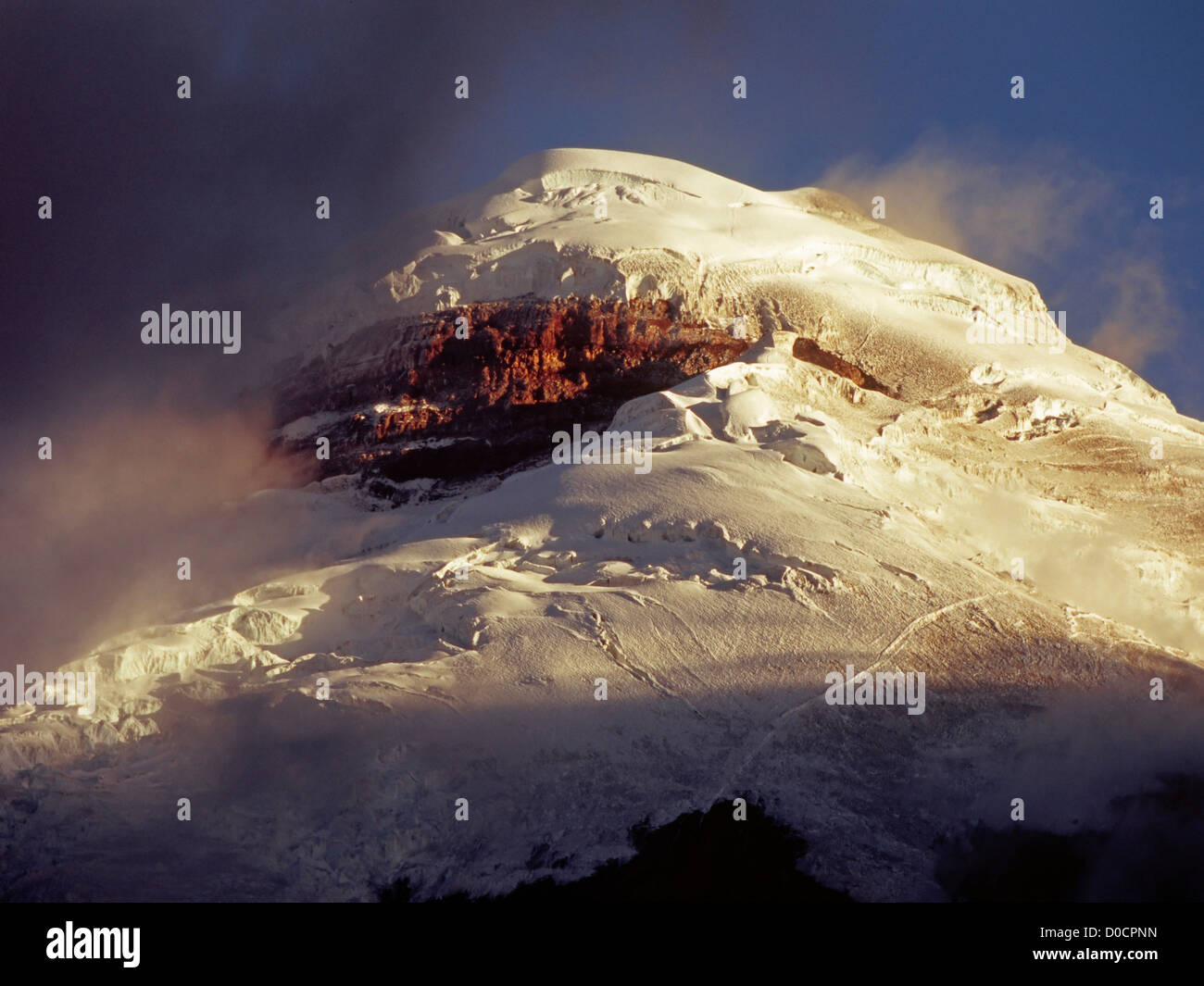 Breaking Clouds Reveal Cotopaxi's Jumbled, Heavily Glaciated Summit Stock Photo