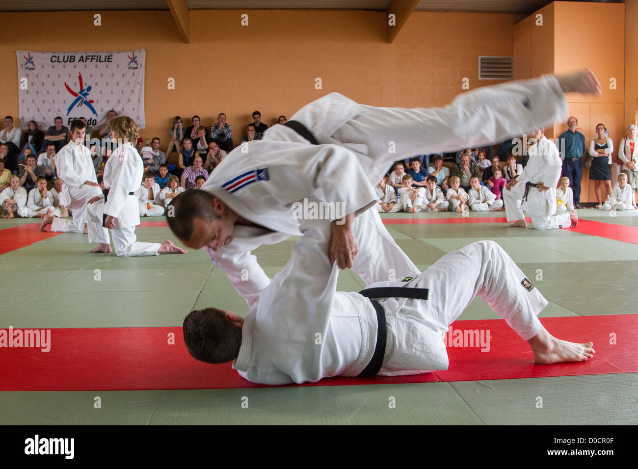 THE JUDOKAS LOSING THEIR BALANCE AND FALLING COMPETITION AND
