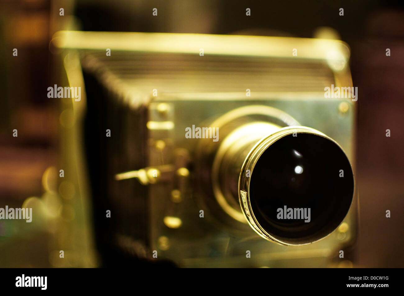 Old folding camera made of brass. Selective Focus on the lens Stock