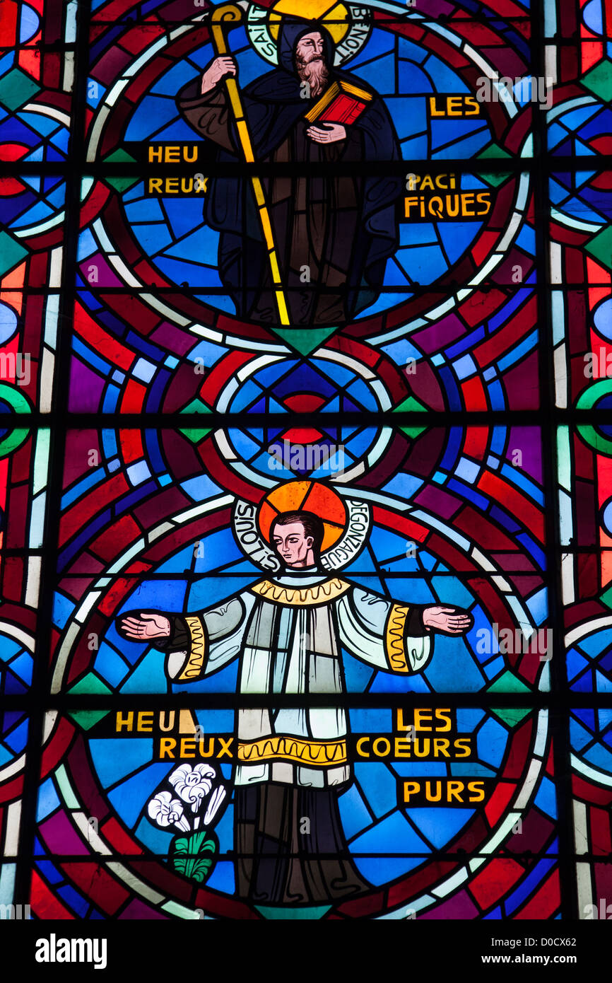 SAINT BENEDICT SAINT ALOYSIUS GONZAGA BLESSED ARE PEACEMAKERS PURE HEART STAINED-GLASS WINDOW IN ABBEY CHURCH NOTRE-DAME IN Stock Photo
