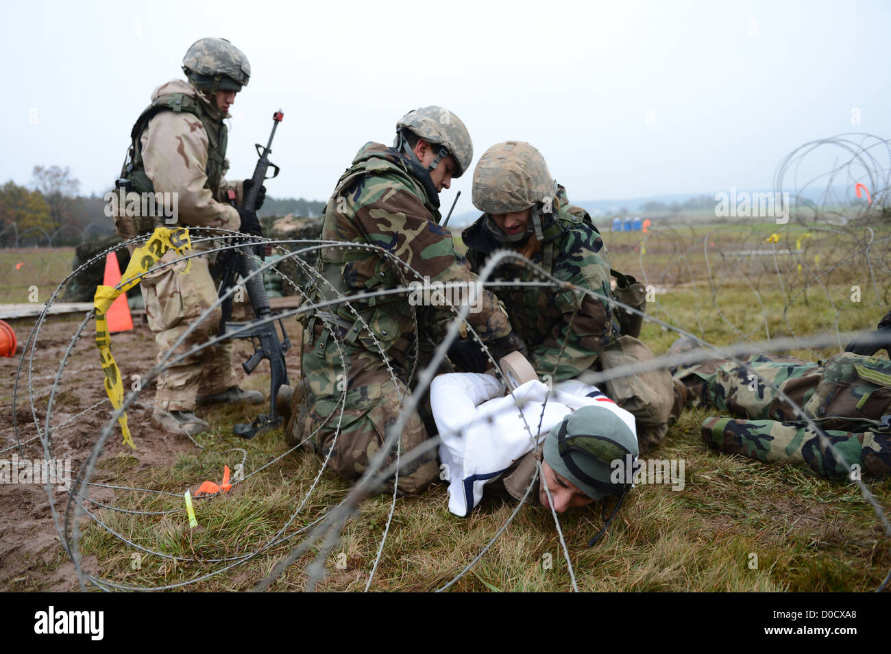 Airmen from the 606th Air Control Squadron search a suspect for weapons ...