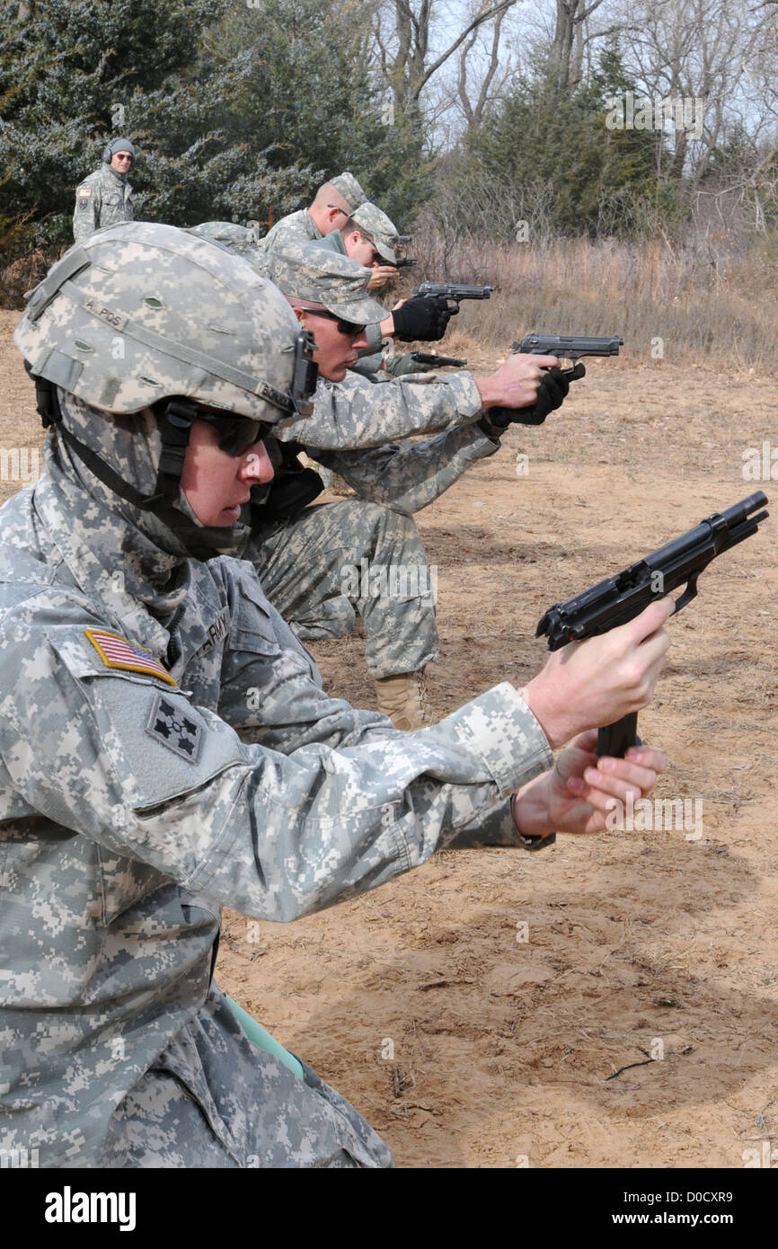 Sgt. John R. Bonjour, a wheeled-vehicle mechanic and Kansas City, Mo., native attached to the 423rd Transportation Company, reloads his weapon during a Marksmanship Proficiency Training Exercise held by the 451st Expeditionary Sustainment Command Nov. 13, Stock Photo