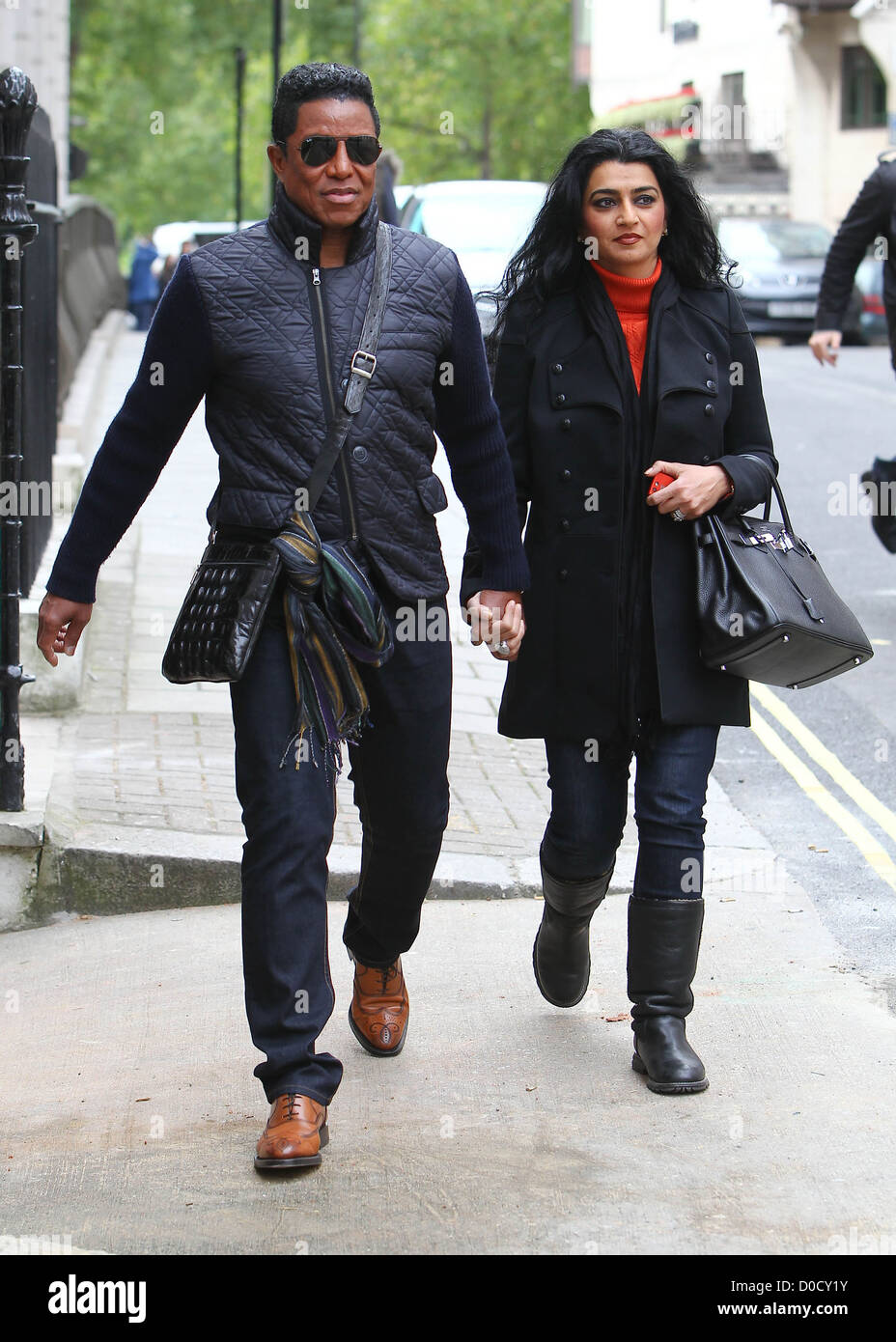 Jermaine Jackson and wife Halima Rashid leaving their hotel and walking