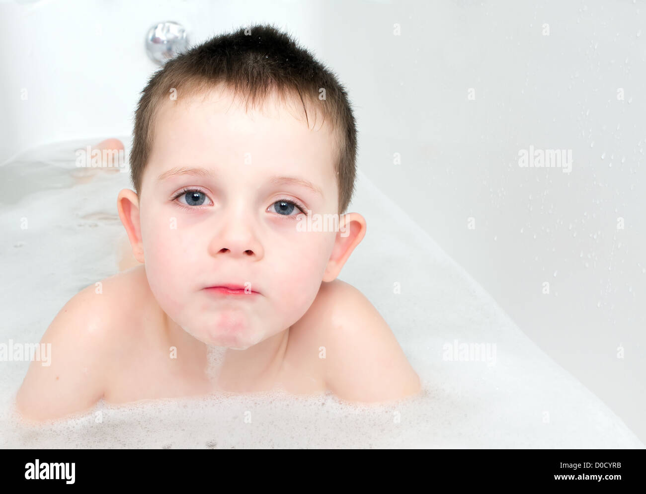 Little Boy in the bath tub with bubbles Stock Photo Alamy