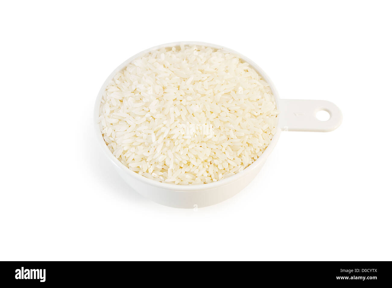 Measuring cup of raw rice isolated on white background Stock Photo Alamy