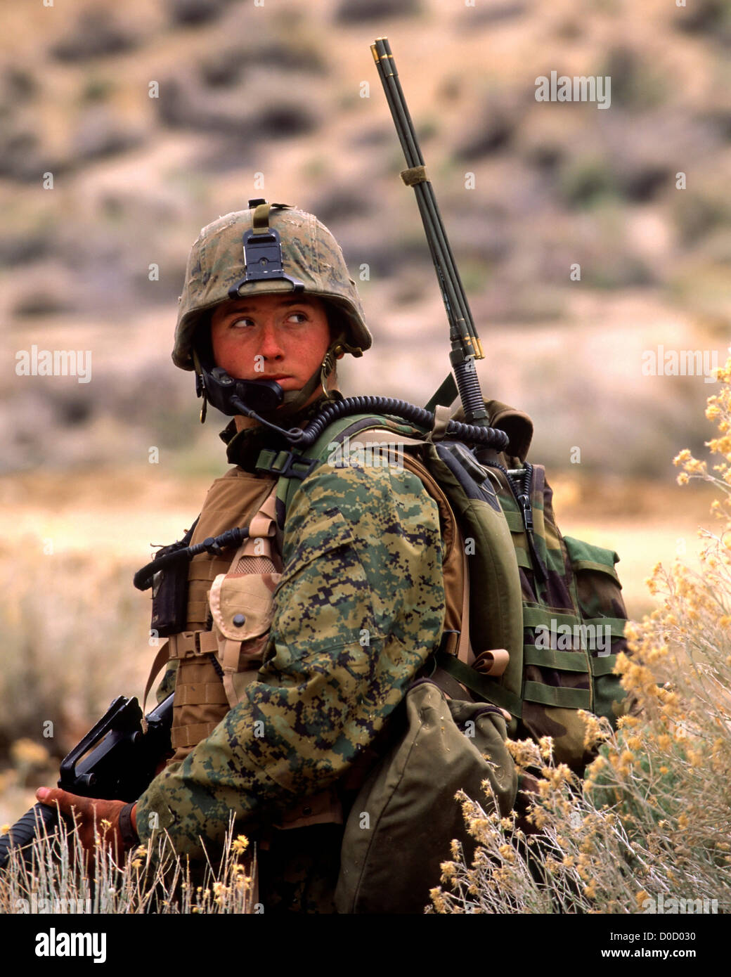 A US Marine Communications Specialist Listens to His Radio During a