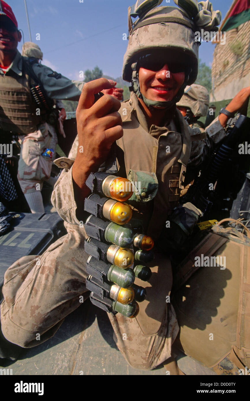 A US Marine En Route Combat Operation Against Taliban Al Qaeda Fighters Shows off His Belt High Explosive Rounds His Grenade Stock Photo