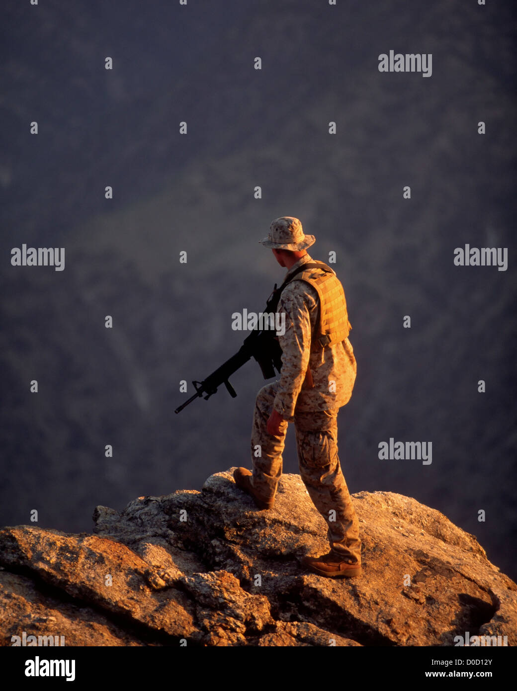 A US Marine Scans a Village Deep in a Valley in Afghanistan's Eastern Kunar Province Stock Photo