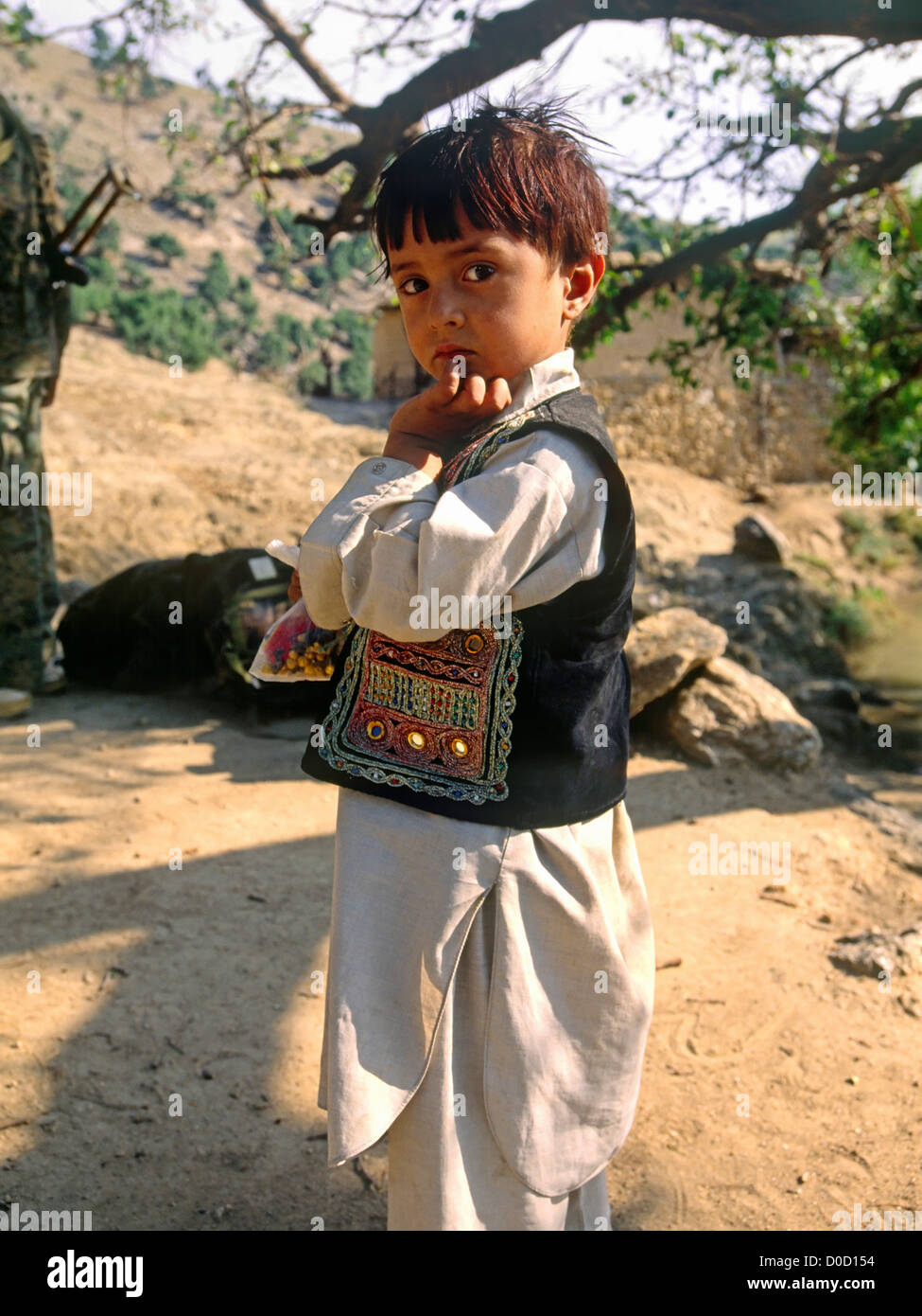 A Young Afghan Boy in a Remote Village Stock Photo
