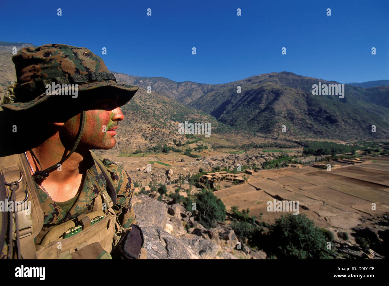 A US Marine Gazes Across The Pech River Valley in Afghanistan's Eastern Kunar Province Stock Photo