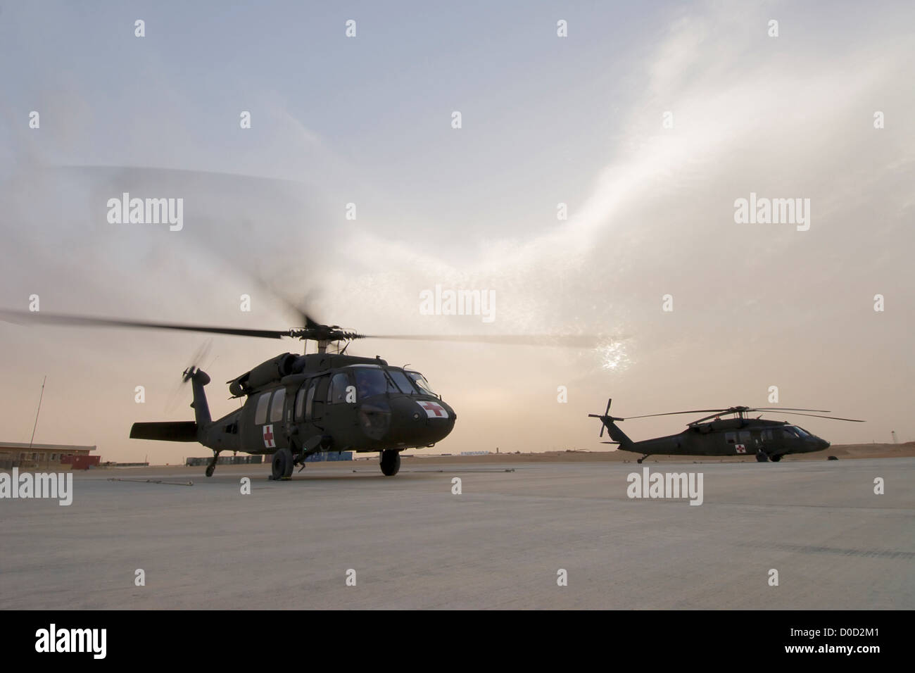 US Army UH-60 Blackhawk MEDEVAC Helicopters Prepare Launch on Nighttime Mission Baghdad Al Asad Air Base in Iraq's Al Anbar Stock Photo