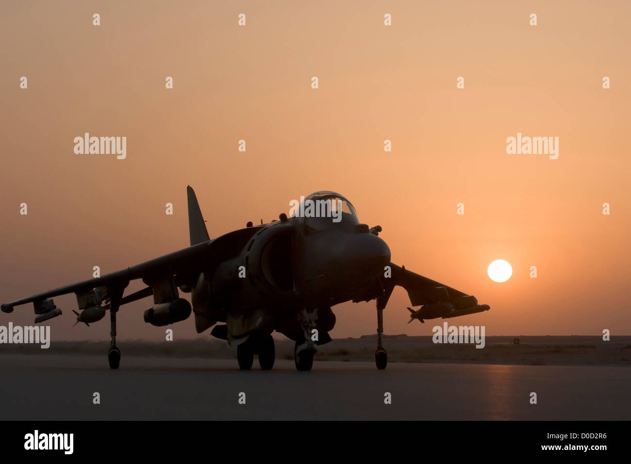 Sunset Landing of a US Marine Corps AV-8B Harrier at Al Asad Air Base in Iraq's Al Anbar Province Stock Photo