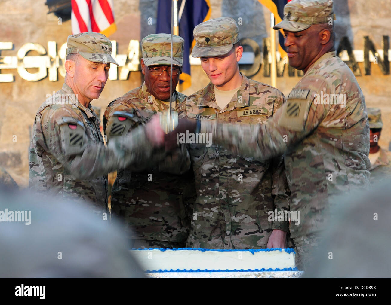 From left, Maj. Gen. Robert â€œAbeâ€ Abrams, 3rd Infantry Division and Regional Command (South) commanding general, Chief Warrant Officer 5 Raymond Noble, Spc. James Jaeger, and Command Sgt. Maj. Edd Watson, 3rd Infantry Division and Regional Command (So Stock Photo