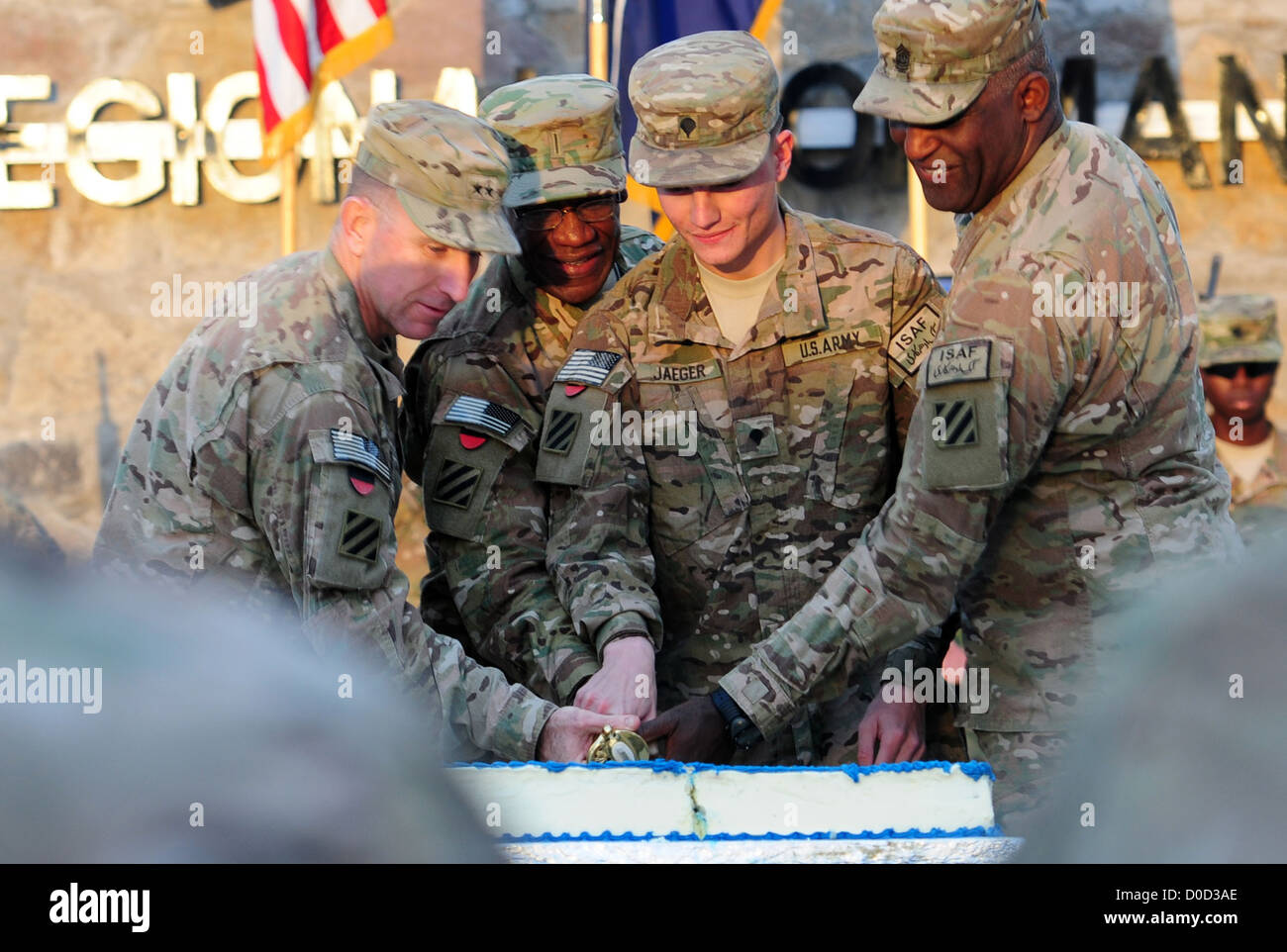 From left, Maj. Gen. Robert â€œAbeâ€ Abrams, 3rd Infantry Division and Regional Command (South) commanding general, Chief Warrant Officer 5 Raymond Noble, Spc. James Jaeger, and Command Sgt. Maj. Edd Watson, 3rd Infantry Division and Regional Command (So Stock Photo
