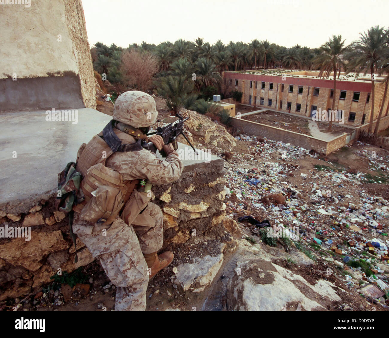 US Marine Provides Cover During a Combat Patrol in Haqlaniyah, Iraq Stock Photo