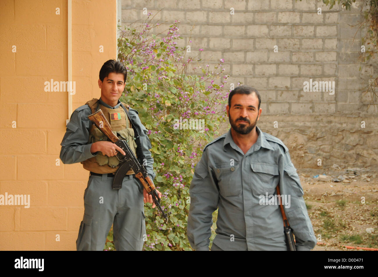 Members of the Afghan National Police (ANP) pose for a photo while providing security at a meeting between the Farah Provincial Stock Photo