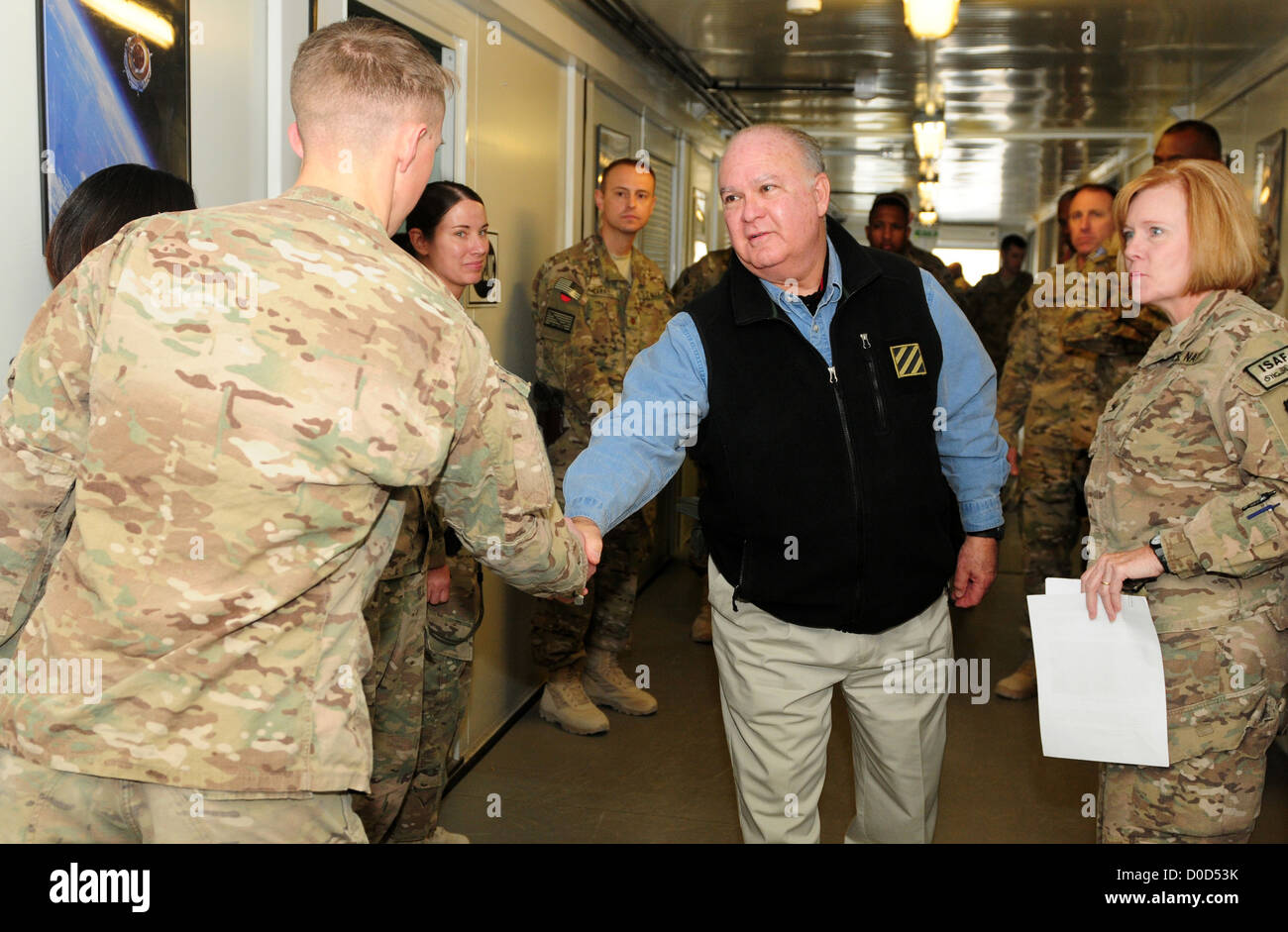 The Honorable Dr. Joseph Westphal, undersecretary of the Army, speaks with service members during a Thanksgiving Day visit at the Warrior Recovery Center on Kandahar Airfield, Afghanistan, Nov. 22, 2012. The senior leader visited service members throughou Stock Photo