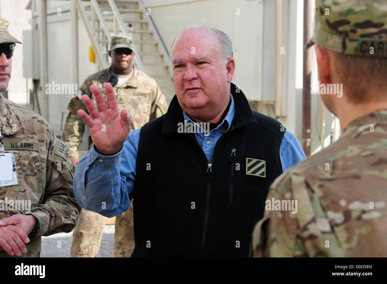The Honorable Dr. Joseph Westphal, undersecretary of the Army, speaks with 3rd Infantry Division service members during a Thanksgiving Day visit at Kandahar Airfield, Afghanistan, Nov. 22, 2012. The senior leader visited service members throughout Afghani Stock Photo