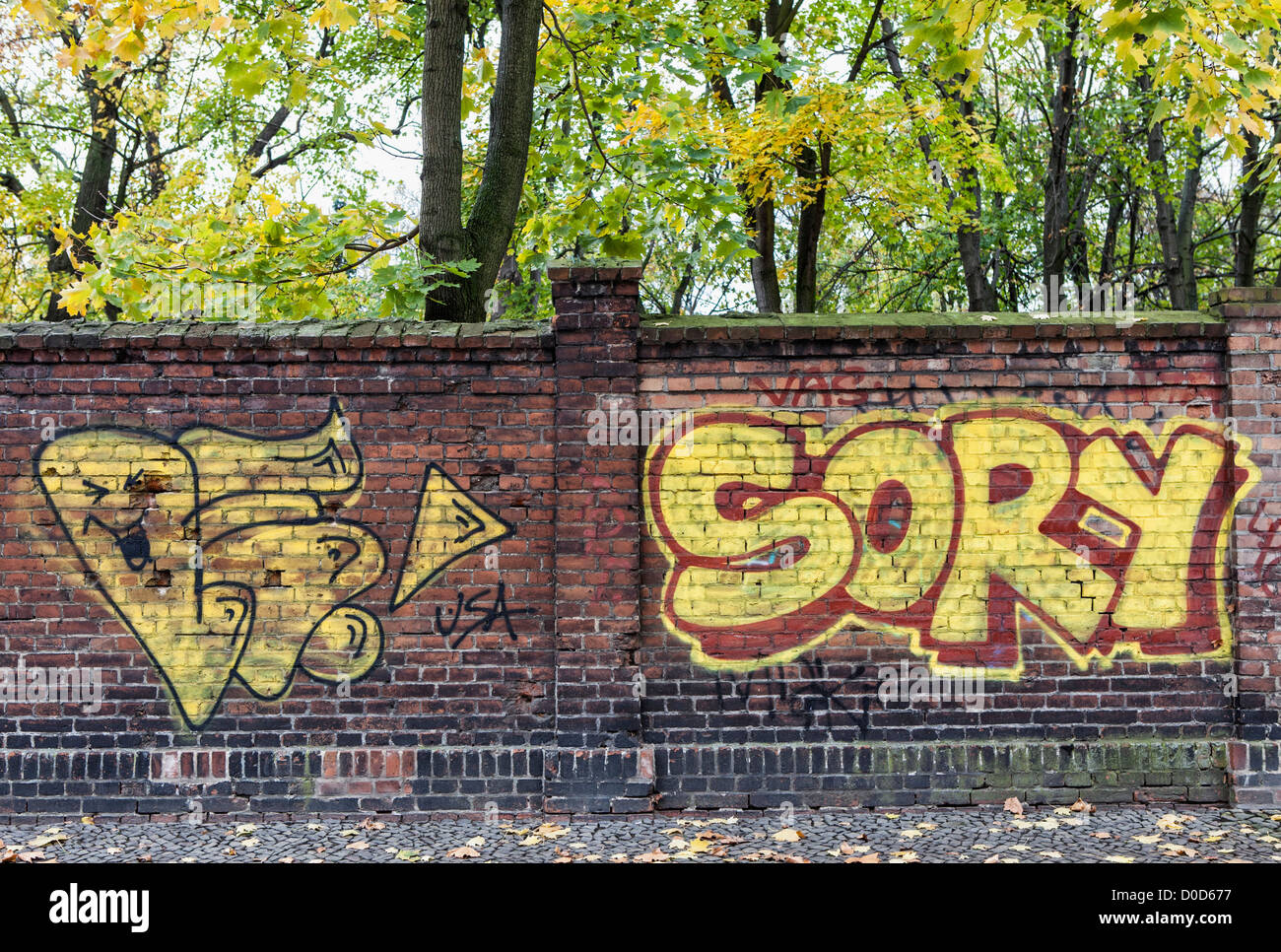 A graffiti-covered wall of the Friedhof der Sophien Gemeinde, Mitte, Berlin Stock Photo