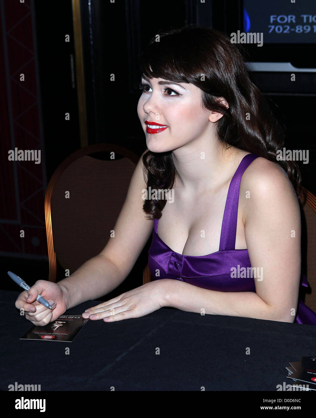 Claire Sinclair, Playboy's Miss October 2010, signs copies of Playboy before her appearance of 'Crazy Horse Paris' at the MGM Stock Photo