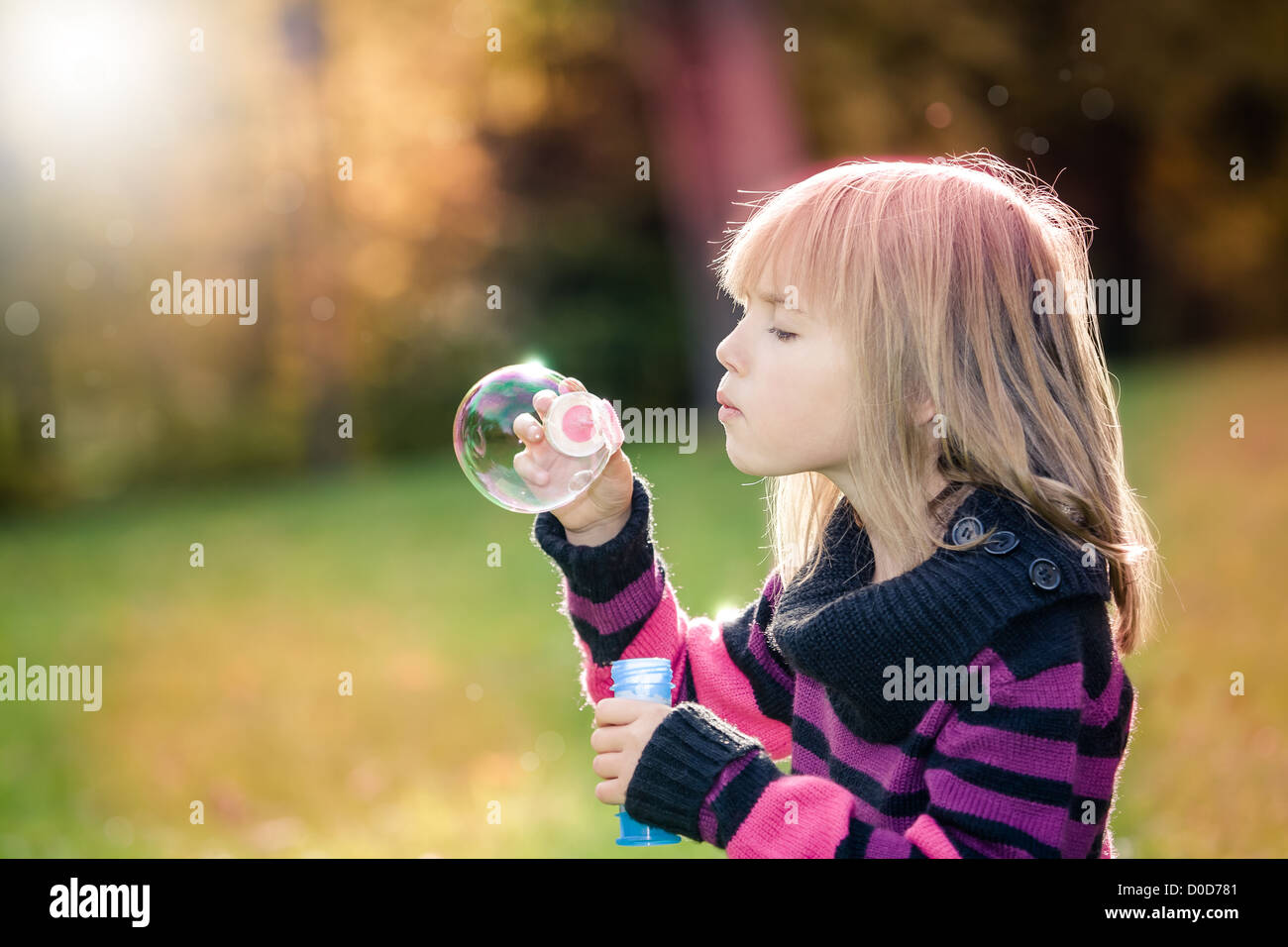 portrait of a little girl in the autumn park Stock Photo - Alamy