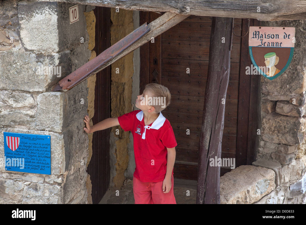 CHILD IN FRONT HOUSE JEANNE BUILT AT END 13TH CENTURY OLDEST HOUSE IN